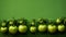 Green tomatoes on a green wooden background. Top view, copy space Generative AI