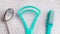 Green toothbrush with dental tools