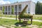 Green topiary statue of grand piano