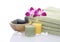 Green Towel, Orchid, Candles and Pebbles