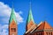 Green towers of Franciscan Church in Old city in Maribor