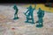 Green toy soldiers on a map