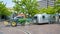 Green tracktor parks a travel trailer