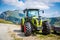 Green tractor on farm in Italian Alps