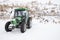 Green tractor in winter in Cappadocia