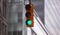 Green traffic lights for cars, blur office buildings background