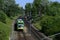 Green tram in sunny day