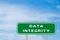 Green transportation sign with word data integrity on blue sky