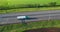 Green truck with a white semi-trailer