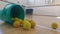 Green tub of spongers tennis balls on the sportshall floor