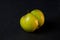 Green ugly apple on a dark background. Concept - Food waste reduction. Using in cooking imperfect products