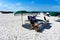 Green umbrellas on white sand in The Don Cesar Hotel beach area.