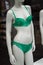 green underwear on mannequin in fashion store showroom for women