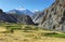 Green valley along Markha valley trek with Kang Yatse peak at background, Ladakh, India