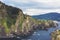 Green valley landscape on background dramatic. View sunlight ocean in trip holiday in basque island Gaztelugatxe. Panorama horizon