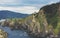 Green valley landscape on background dramatic. View sunlight ocean in trip holiday in basque island Gaztelugatxe. Panorama horizon