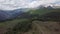 Green valley with roads, stones, waterflows in Abkhazia mountains