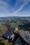 Green valley from the rocky top of the mount vertical