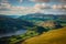 Green valley and Thirlmere Lake is seen from Helvellyn in the English Lake District, sunny day, hills and mountains