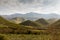 Green valleys with mountains in the background