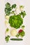 Green variety salad vegetables: lettuce,cucmber,radishes, fennel, kohlrabi on white wooden background