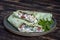 Green vegan burrito. Sliced up raw food wrap with vegan ingredients on a plate