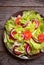 Green vegetable salad with lattuce, tomatos, onion. Healthy food concept