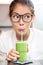 Green vegetable smoothie juice - woman drinking