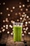 Green vegetable smoothie with party lights