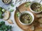 Green vegetable vegan soup from keil, brussels sprouts, zucchini, leek with various germinated seeds and sprouts with croutons on