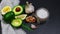 Green vegetables avocados,lemon, garlic,sea salt, on a shale board, Healthy eating. Authentic lifestyle image. copy space, top vie