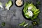 Green vegetables snack board with various dips. Yogurt sauce or labneh, hummus, with fresh vegetables.