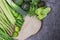 Green vegetables on a wooden frame.