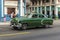 Green vintage Chevrolet taxi Havana