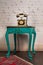 Green vintage wooden table and old golden telephone set