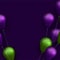 Green and violet foil balloons with threads on dark violet background