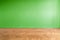 Green wall background in empty room with parquet floor