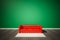 Green wall and dark wood floor, with red sofa and white carpet, 3d renderd