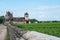 Green walled grand cru and premier cru vineyards with rows of pinot noir grapes plants in Cote de nuits, making of famous red