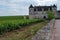 Green walled grand cru and premier cru vineyards with rows of pinot noir grapes plants in Cote de nuits, making of famous red