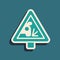 Green Warning road sign throwing stone materials icon isolated on green background. Traffic rules and safe driving. Long