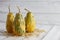 Green warty pumpkins on white planks