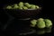 Green wasabi peanut isolated on black glass