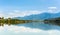 Green water Weissensee lake in Alps Mountains