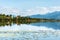 Green water Weissensee lake in Alps Mountains