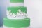 Green wedding cake decorated with sugar flowers