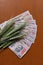 Green wheat ears with 1000 Indian Rupee notes