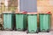 Green wheelie bins in row uk