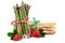 Green and white asparagus with strawberries. Fresh healthy vegetables on white