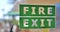 Green and white fire exit sign